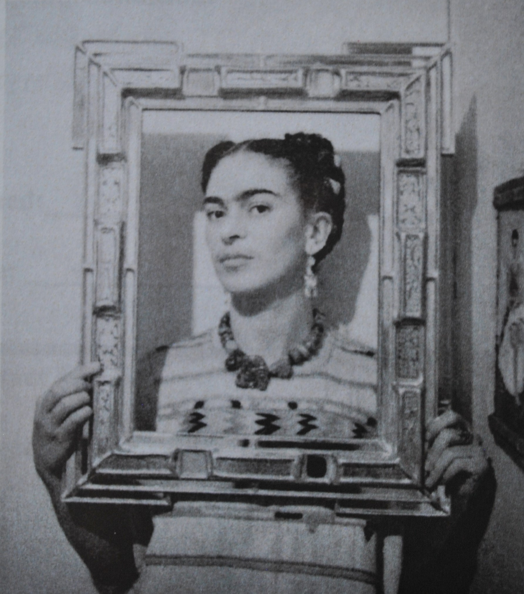 Photographic portrait of Frida Kahlo within a picture frame